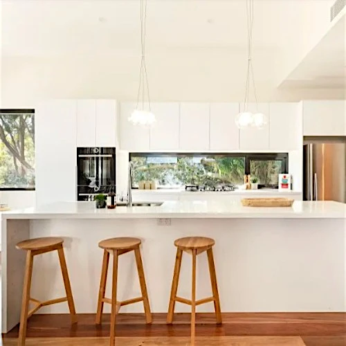bocci 28.3 clear glass pendant light over kitchen bench